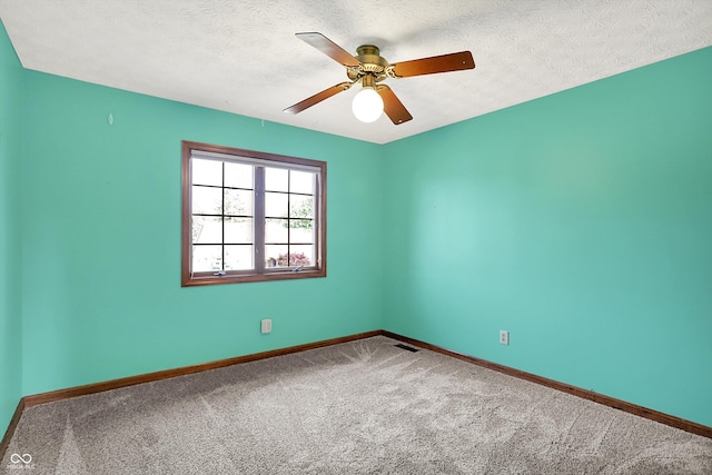8619 Wrangler Ct, Indianapolis, IN 46217 - carpeted spare room featuring baseboards, a ceiling fan, and a textured ceiling