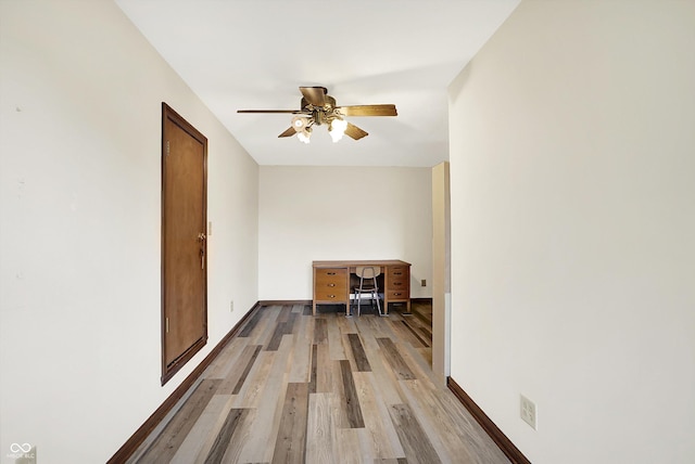 8619 Wrangler Ct, Indianapolis, IN 46217 - empty room with light wood finished floors, ceiling fan, and baseboards