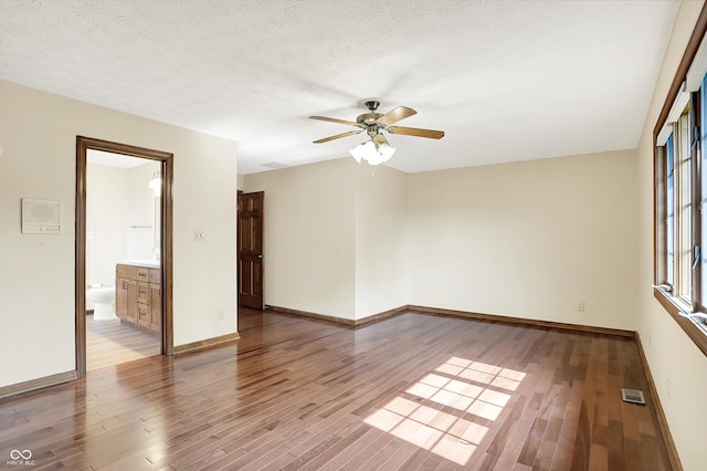 8619 Wrangler Ct, Indianapolis, IN 46217 - spare room with ceiling fan, light wood-type flooring, and baseboards