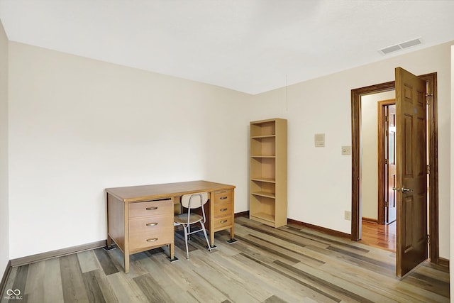 8619 Wrangler Ct, Indianapolis, IN 46217 - office area featuring light wood finished floors and baseboards