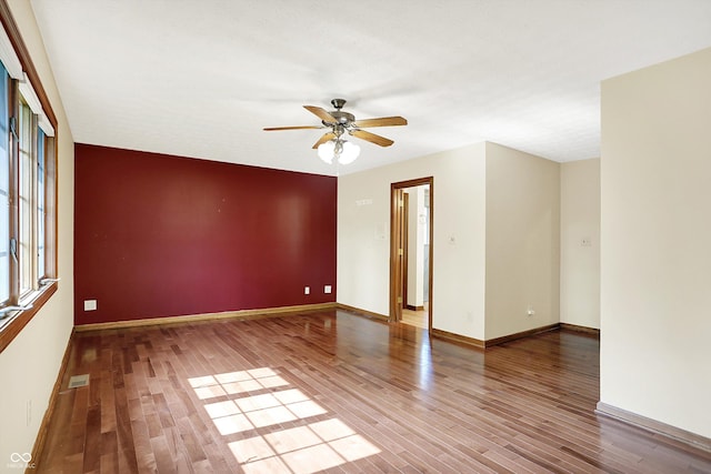 8619 Wrangler Ct, Indianapolis, IN 46217 - spare room featuring a ceiling fan, wood finished floors, and baseboards