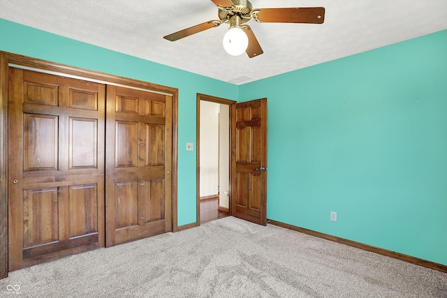 8619 Wrangler Ct, Indianapolis, IN 46217 - unfurnished bedroom featuring carpet, baseboards, a ceiling fan, and a closet