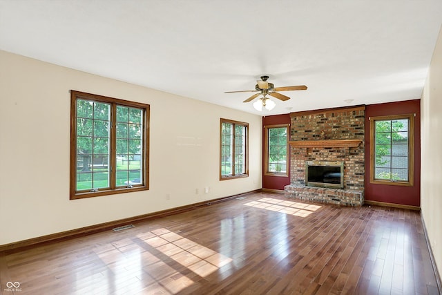 8619 Wrangler Ct, Indianapolis, IN 46217 - unfurnished living room featuring healthy amount of natural light, ceiling fan, and wood finished floors