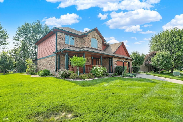 8619 Wrangler Ct, Indianapolis, IN 46217 - view of front facade with concrete driveway, a porch, a front lawn, brick siding, and stone siding