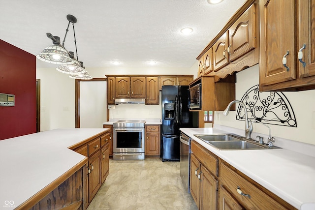 8619 Wrangler Ct, Indianapolis, IN 46217 - kitchen with black appliances, under cabinet range hood, a sink, light countertops, and brown cabinetry