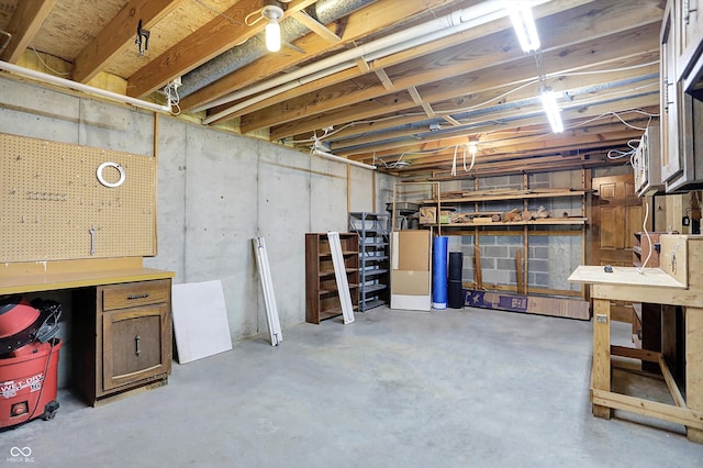 8619 Wrangler Ct, Indianapolis, IN 46217 - unfinished basement featuring a workshop area