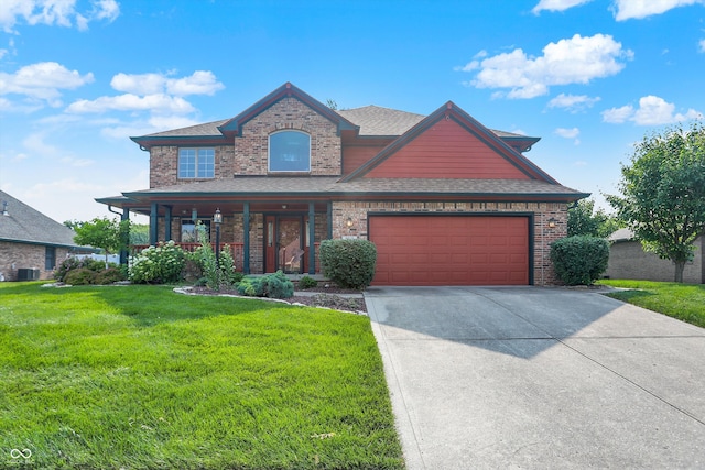 8619 Wrangler Ct, Indianapolis, IN 46217 - view of front of house with a front lawn, brick siding, driveway, and a shingled roof
