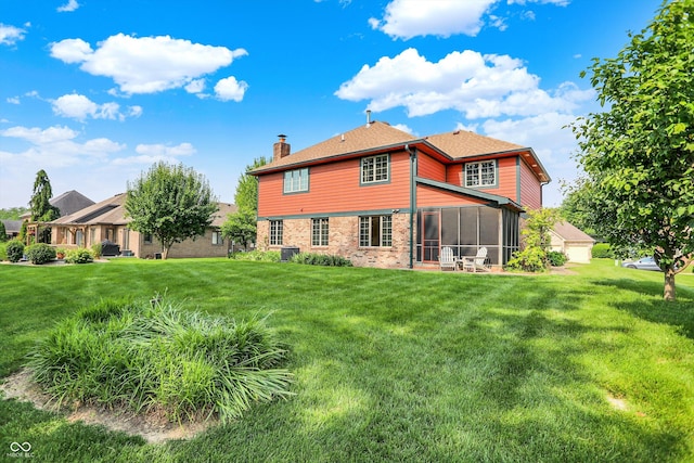 8619 Wrangler Ct, Indianapolis, IN 46217 - back of house featuring a chimney, brick siding, a sunroom, and a lawn