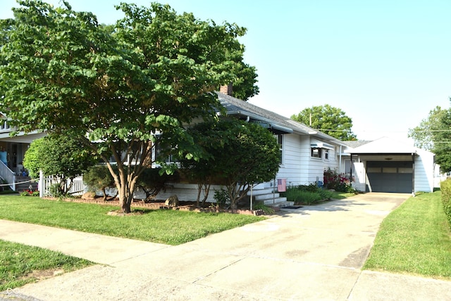 1641 Winton Ave, Speedway, IN 46224 - view of front of property featuring a garage, a front yard, driveway, and an outdoor structure
