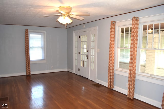 1641 Winton Ave, Speedway, IN 46224 - empty room featuring dark wood-style floors, baseboards, crown molding, and ceiling fan