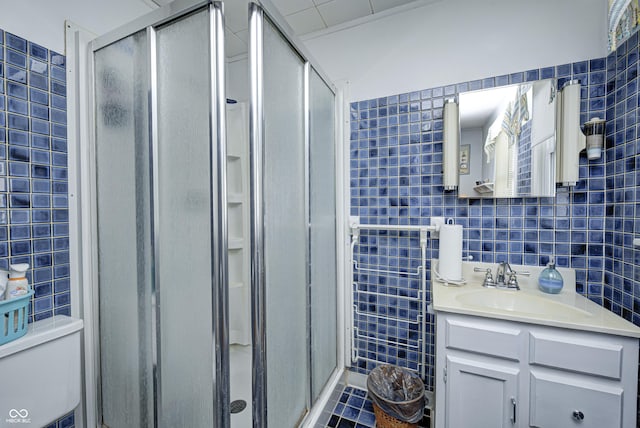 1641 Winton Ave, Speedway, IN 46224 - full bathroom with tile walls, a shower stall, vanity, and toilet