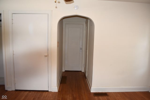 1641 Winton Ave, Speedway, IN 46224 - hallway featuring arched walkways, wood finished floors, and baseboards