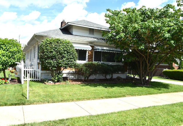 1641 Winton Ave, Speedway, IN 46224 - view of front of property featuring a chimney and roof with shingles