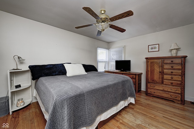 1641 Winton Ave, Speedway, IN 46224 - bedroom with light wood finished floors, baseboards, and a ceiling fan