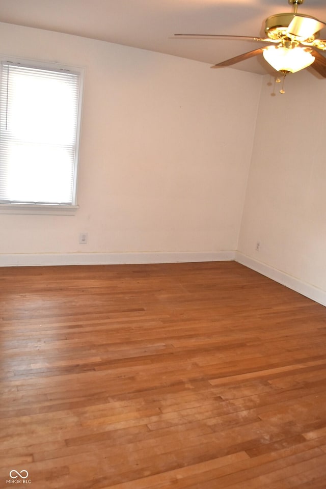 1641 Winton Ave, Speedway, IN 46224 - empty room with wood finished floors, a ceiling fan, and baseboards