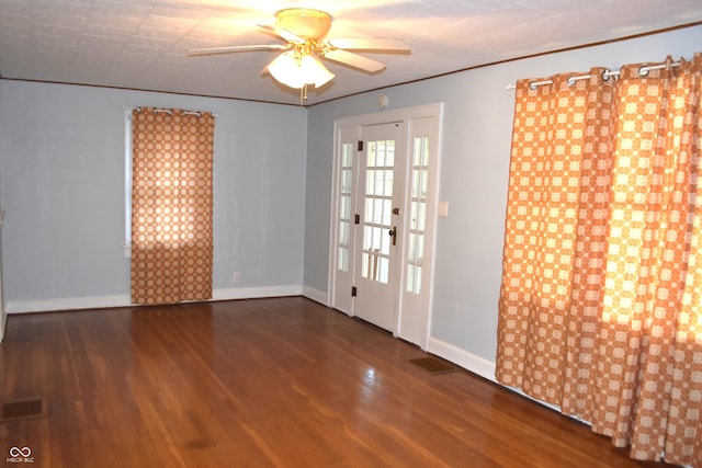 1641 Winton Ave, Speedway, IN 46224 - spare room featuring wood finished floors, ceiling fan, and baseboards