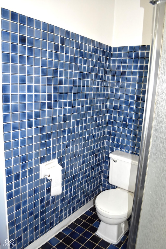 1641 Winton Ave, Speedway, IN 46224 - bathroom with toilet, tile walls, and tile patterned flooring