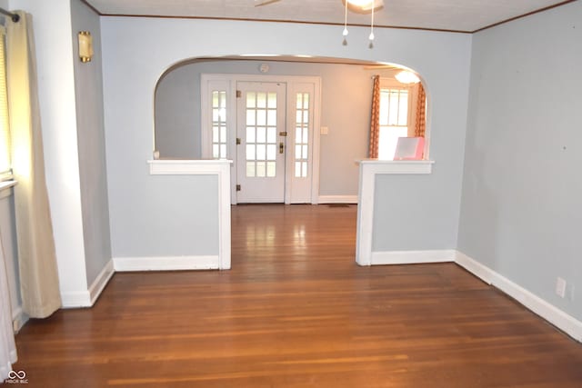 1641 Winton Ave, Speedway, IN 46224 - entryway featuring crown molding, arched walkways, wood finished floors, baseboards, and ceiling fan