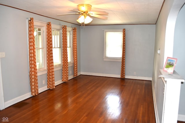 1641 Winton Ave, Speedway, IN 46224 - unfurnished room featuring ceiling fan, wood finished floors, arched walkways, and baseboards