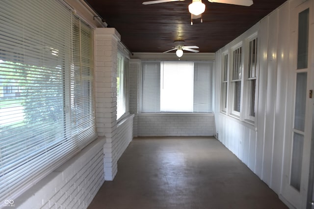 1641 Winton Ave, Speedway, IN 46224 - unfurnished sunroom featuring finished concrete floors, brick wall, and wood ceiling