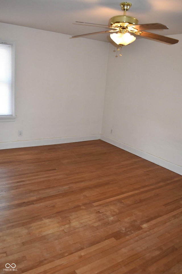 1641 Winton Ave, Speedway, IN 46224 - empty room with a ceiling fan, wood finished floors, and baseboards