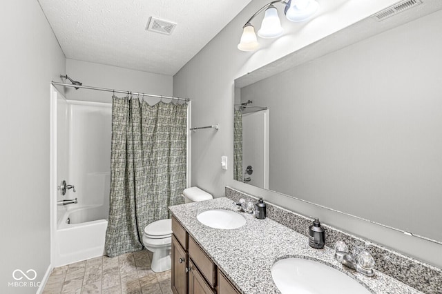 4642 Big Run Ct, Indianapolis, IN 46239 - full bathroom featuring toilet, shower / bathtub combination with curtain, double vanity, and a textured ceiling