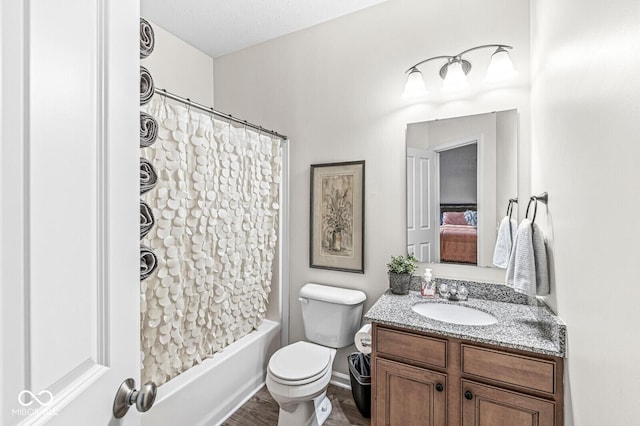 4642 Big Run Ct, Indianapolis, IN 46239 - full bathroom with vanity, toilet, shower / bath combination with curtain, wood finished floors, and ensuite bath