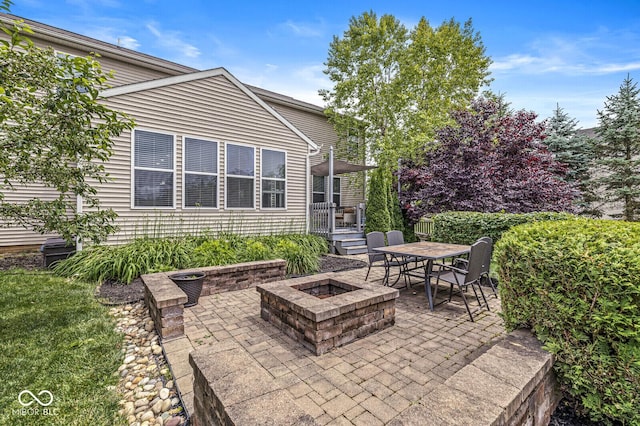 4642 Big Run Ct, Indianapolis, IN 46239 - view of patio / terrace with a fire pit and outdoor dining space
