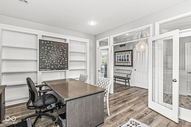 4642 Big Run Ct, Indianapolis, IN 46239 - office featuring french doors, wood finished floors, a textured ceiling, and recessed lighting