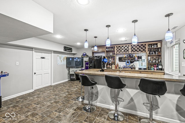 4642 Big Run Ct, Indianapolis, IN 46239 - kitchen with black fridge with ice dispenser, baseboards, open shelves, a breakfast bar area, and recessed lighting