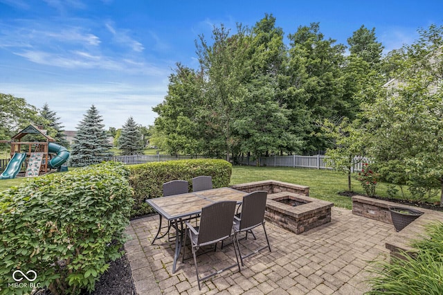 4642 Big Run Ct, Indianapolis, IN 46239 - view of patio with an outdoor fire pit, a playground, a water view, and outdoor dining area