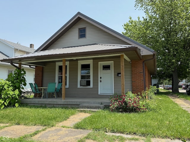 1126 S 20th St, New Castle, IN 47362 - bungalow-style house with a porch and brick siding