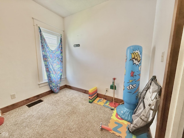 1126 S 20th St, New Castle, IN 47362 - game room with carpet floors and baseboards