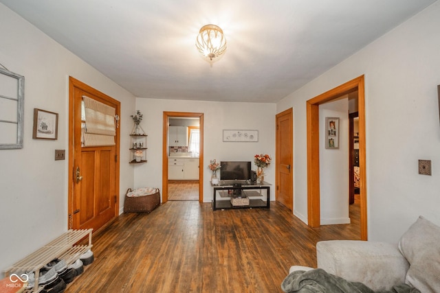 3004 Sheridan St, Anderson, IN 46016 - foyer entrance with dark wood-type flooring and baseboards