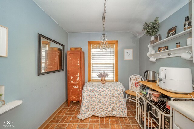 3004 Sheridan St, Anderson, IN 46016 - dining space with brick patterned floors, baseboards, and lofted ceiling