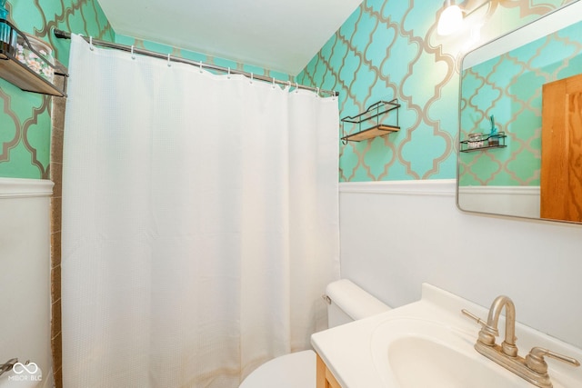 3004 Sheridan St, Anderson, IN 46016 - full bathroom with toilet, wainscoting, wallpapered walls, vanity, and curtained shower