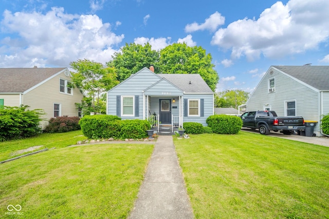 3004 Sheridan St, Anderson, IN 46016 - bungalow-style house with a front lawn and a chimney