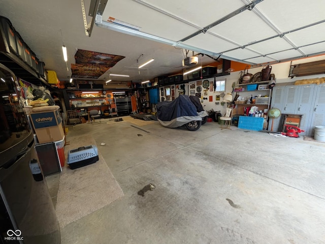 317 Washington St, Clay City, IN 47841 - garage featuring a garage door opener and a workshop area
