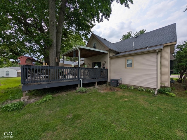317 Washington St, Clay City, IN 47841 - back of property with a deck, a yard, central AC, and roof with shingles