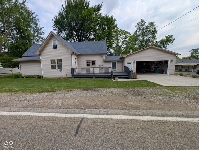 317 Washington St, Clay City, IN 47841 - view of front of home featuring concrete driveway, a deck, an attached garage, and a front lawn
