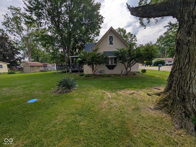 317 Washington St, Clay City, IN 47841 - view of side of home with a lawn and a deck