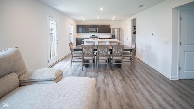 2916 W Bargello Ln, Monrovia, IN 46157 - dining room featuring light wood-type flooring, baseboards, and recessed lighting