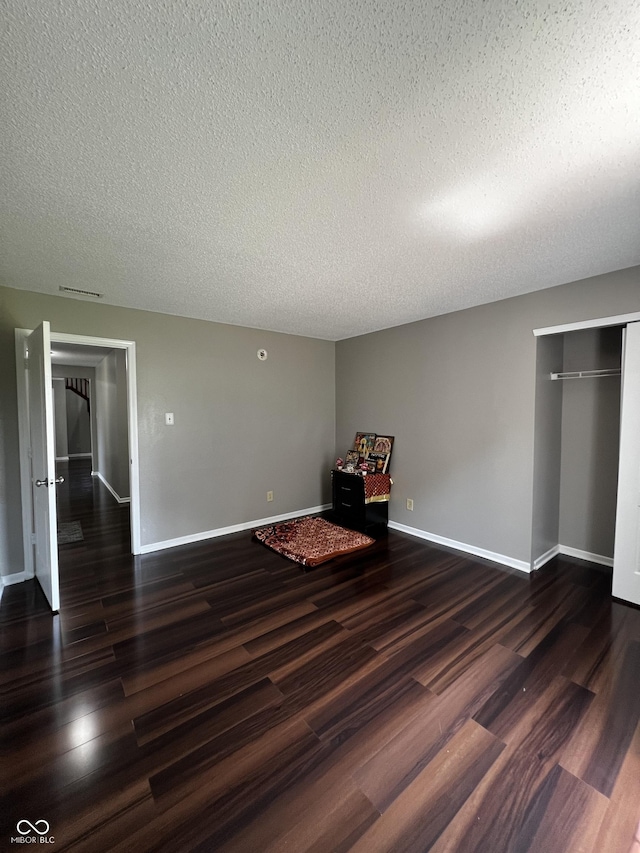 585 Fireside Dr, Greenwood, IN 46143 - unfurnished room featuring wood finished floors and a textured ceiling