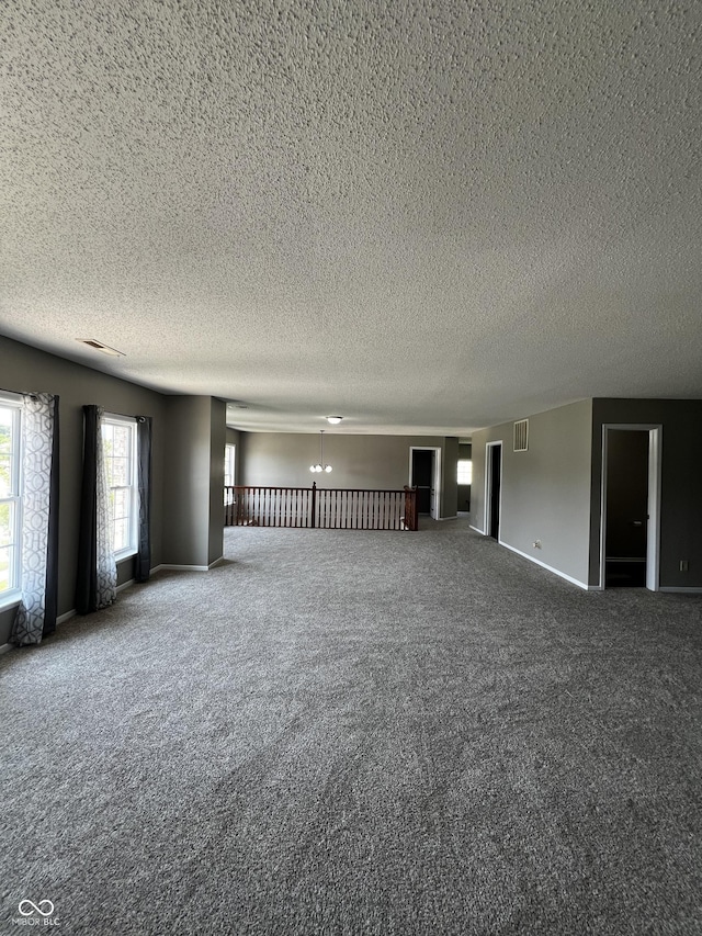 585 Fireside Dr, Greenwood, IN 46143 - spare room with carpet and a textured ceiling