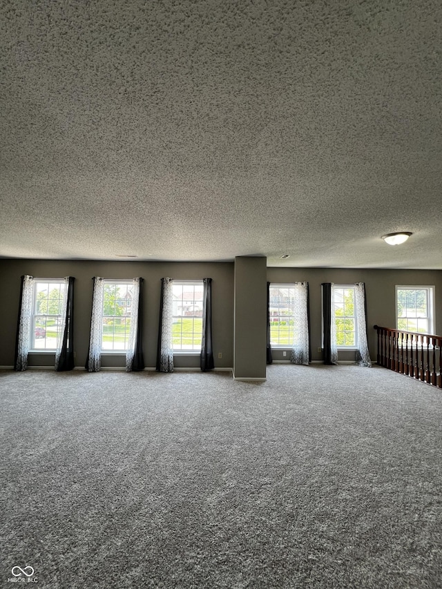 585 Fireside Dr, Greenwood, IN 46143 - carpeted spare room featuring a textured ceiling and healthy amount of natural light
