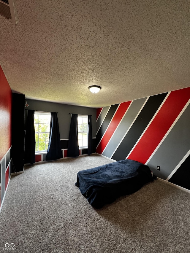 585 Fireside Dr, Greenwood, IN 46143 - bedroom featuring a textured ceiling and carpet flooring