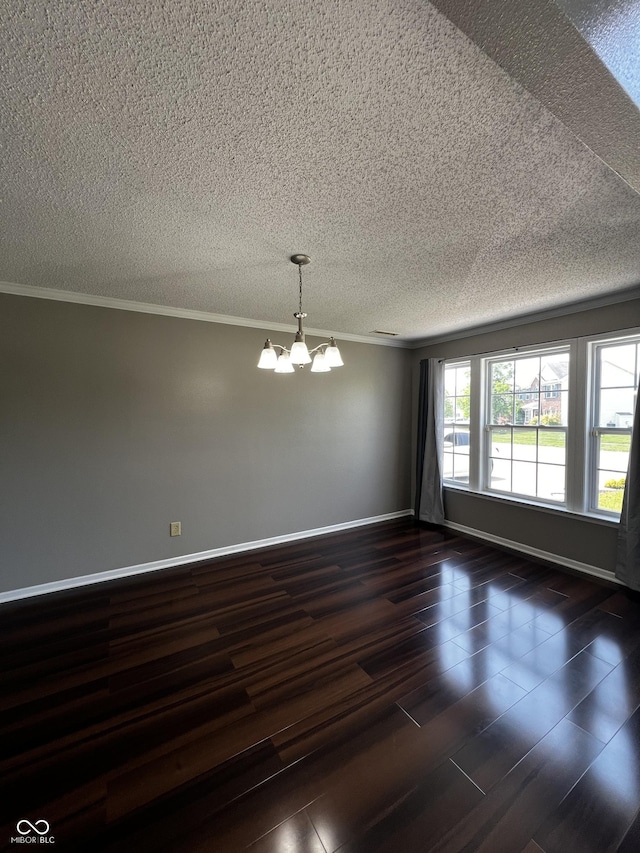 585 Fireside Dr, Greenwood, IN 46143 - spare room featuring a chandelier, a textured ceiling, crown molding, and dark wood-type flooring