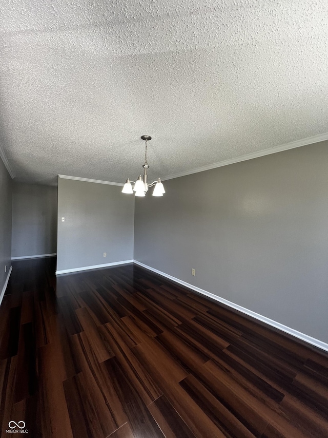 585 Fireside Dr, Greenwood, IN 46143 - empty room featuring dark wood finished floors, a chandelier, a textured ceiling, and crown molding