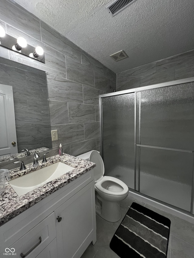585 Fireside Dr, Greenwood, IN 46143 - full bath with a textured ceiling, vanity, and a shower stall