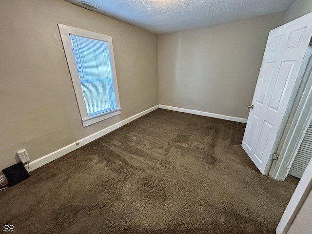 307 N Arlington Ave, Indianapolis, IN 46219 - spare room with dark colored carpet and baseboards